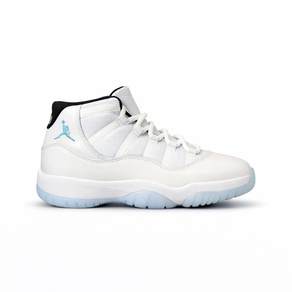 Air Jordan 11 Retro "Legend Blue" sneakers in white with legend blue and black accents.